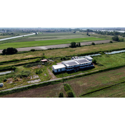 LOTTO UNICO: FABBRICATO COMMERCIALE IN CORSO DI COSTRUZIONE E TERRENO